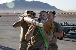 An Aim 9x Infrared Guided Air To Air Missile Is Loaded Onto A Us Military Combat Aircraft An Aim 9x Infrared Guided Air To Air Missile Is Loaded Onto A Us Military Combat Aircraft