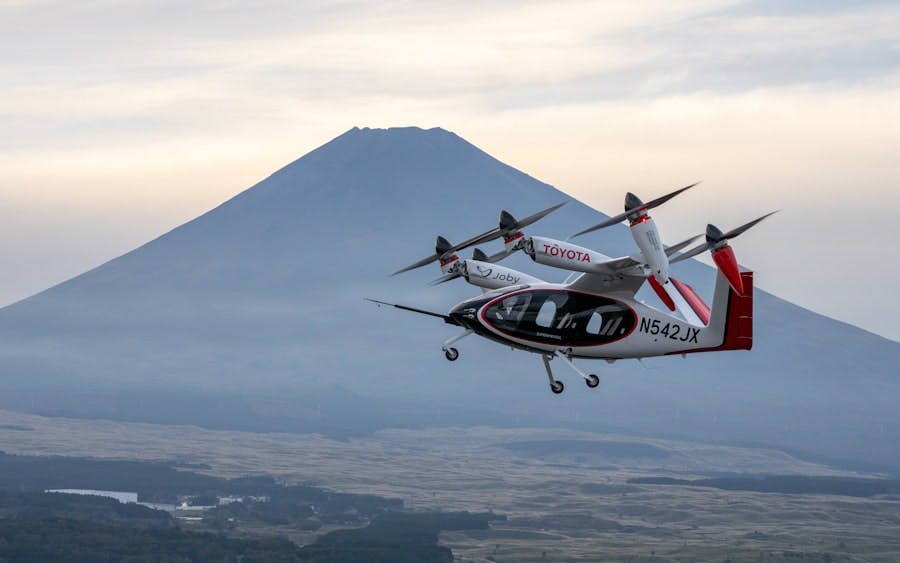 A Joby production prototype electric air taxi flying in front of Mount Fuji in Shizuoka, Japan. Photo by Joby Aviation.