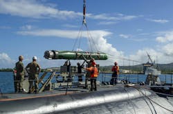 Sailors load a MK 48 torpedo aboard the Los Angeles-class attack submarine USS Annapolis. Sailors load a MK 48 torpedo aboard the Los Angeles-class attack submarine USS Annapolis.