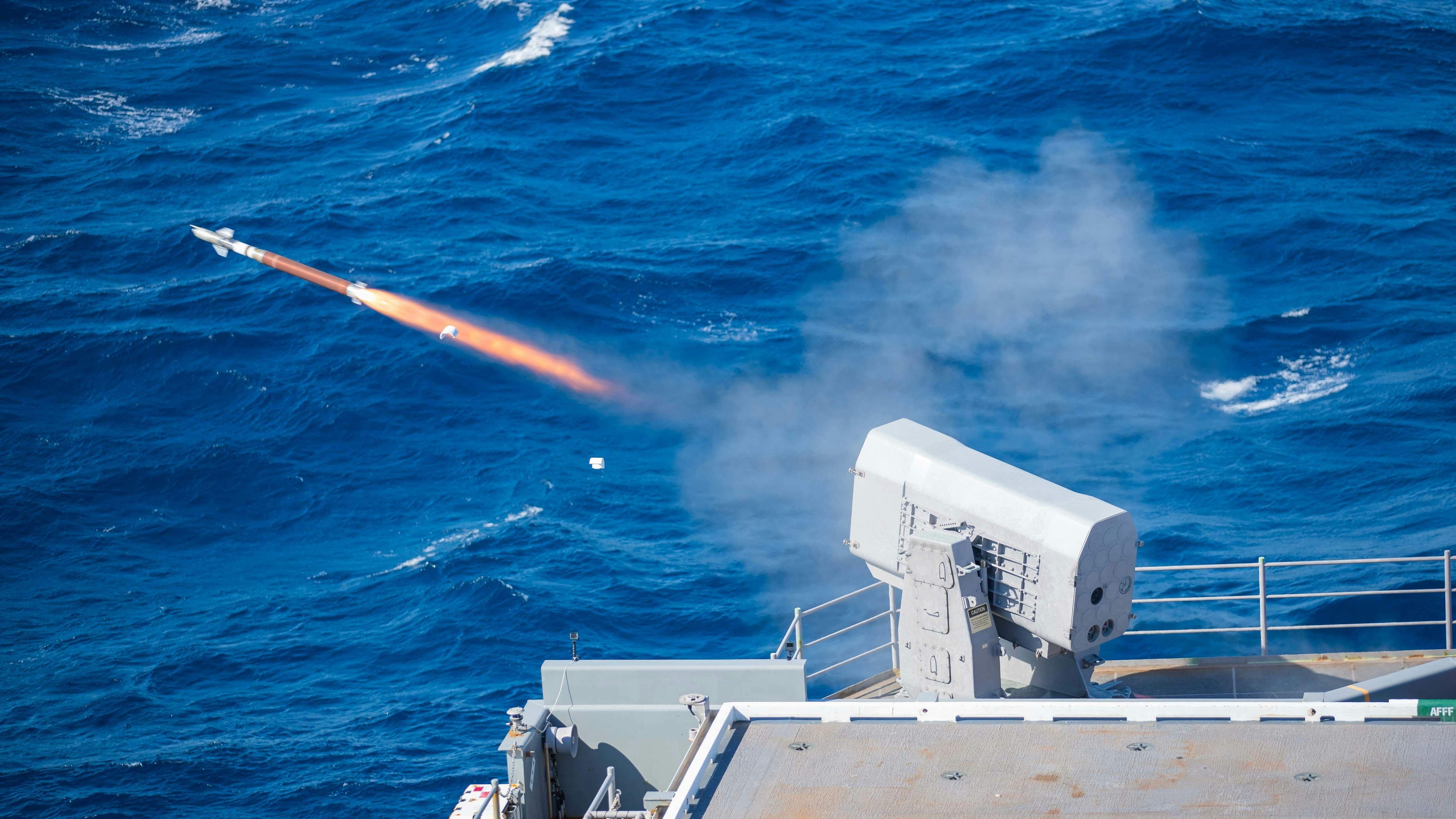 A rolling airframe missile (RAM) launcher fires a RIM-116 missile from the aircraft carrier USS Gerald R. Ford (CVN 78) during combat systems ship qualification trials.
