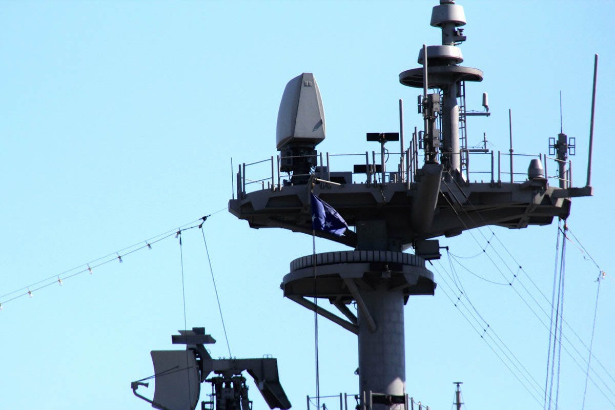The AN/SPQ-9B X-band radar that scans the horizon for low-flying anti-ship cruise missiles, enemy ships, and aircraft.