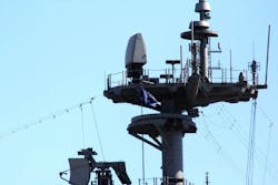 The AN/SPQ-9B X-band radar that scans the horizon for low-flying anti-ship cruise missiles, enemy ships, and aircraft. The AN/SPQ-9B X-band radar that scans the horizon for low-flying anti-ship cruise missiles, enemy ships, and aircraft.