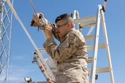 A U.S. Marine Corps transmission systems operator installs a 5G antenna for a demonstrat at the Marine Corps Air Ground Combat Center at Twentynine Palms, Calif. U.S. Marine Corps photo by Pfc. Ryan Kennelly A U.S. Marine Corps transmission systems operator installs a 5G antenna for a demonstrat at the Marine Corps Air Ground Combat Center at Twentynine Palms, Calif. U.S. Marine Corps photo by Pfc. Ryan Kennelly