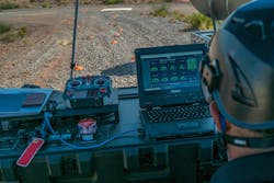 An AT&T civilian contractor monitors the status interface of a 'Cell on Wings' drone to provide 5G connectivity at White Sands Missile Range, N.M. U.S. Air Force photo by Staff Sgt. Charlye Alonso An AT&T civilian contractor monitors the status interface of a 'Cell on Wings' drone to provide 5G connectivity at White Sands Missile Range, N.M. U.S. Air Force photo by Staff Sgt. Charlye Alonso