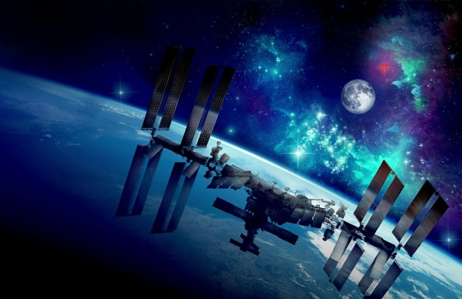 An artist’s concept of the International Space Station orbiting Earth.