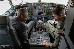 A Navy pilot explains the functions of instruments in the cockpit of a P-8A Posideon aerial surveillance jet. A Navy pilot explains the functions of instruments in the cockpit of a P-8A Posideon aerial surveillance jet.