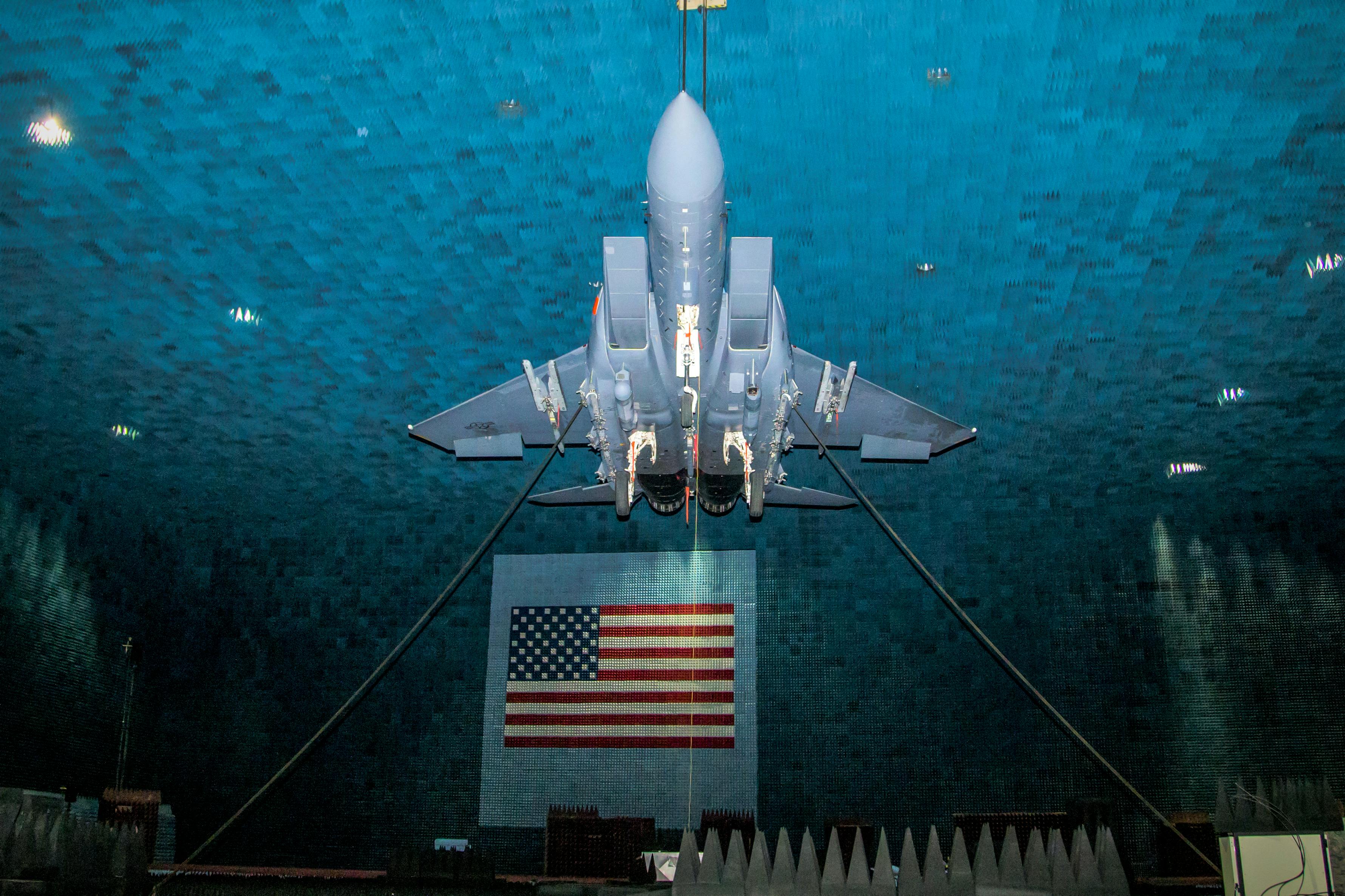 An F-15E hangs from the ceiling of the Benefield Anechoic Facility during testing of the Eagle Passive/Active Warning and Survivability System (EPAWSS) at Edwards Air Force Base, Calif.