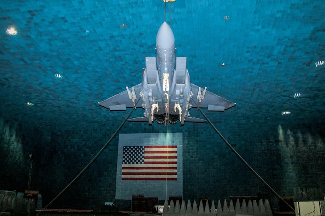 An F-15E hangs from the ceiling of the Benefield Anechoic Facility during testing of the Eagle Passive/Active Warning and Survivability System (EPAWSS) at Edwards Air Force Base, Calif.