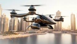 A rending of a passenger-carrying electric quadcopter as it flies over a body of water adjacent to an urban area A rending of a passenger-carrying electric quadcopter as it flies over a body of water adjacent to an urban area