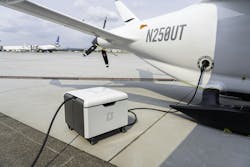 A Beta Technologies power cube plugged into an airplane. A Beta Technologies power cube plugged into an airplane.