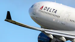 A Delta-branded Airbus commercial jet takes off.