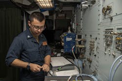 A U.S. Navy aviation electronics technician calibrates eCASS test equipment aboard the aircraft carrier USS Abraham Lincoln (CVN 72) A U.S. Navy aviation electronics technician calibrates eCASS test equipment aboard the aircraft carrier USS Abraham Lincoln (CVN 72)