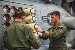 Naval air crewmen inspect and load sonobuoys into an MH-60R Sea Hawk helicopter on the flight deck of the Arleigh Burke-class guided-missile destroyer USS Paul Ignatius (DDG 117). Naval air crewmen inspect and load sonobuoys into an MH-60R Sea Hawk helicopter on the flight deck of the Arleigh Burke-class guided-missile destroyer USS Paul Ignatius (DDG 117).