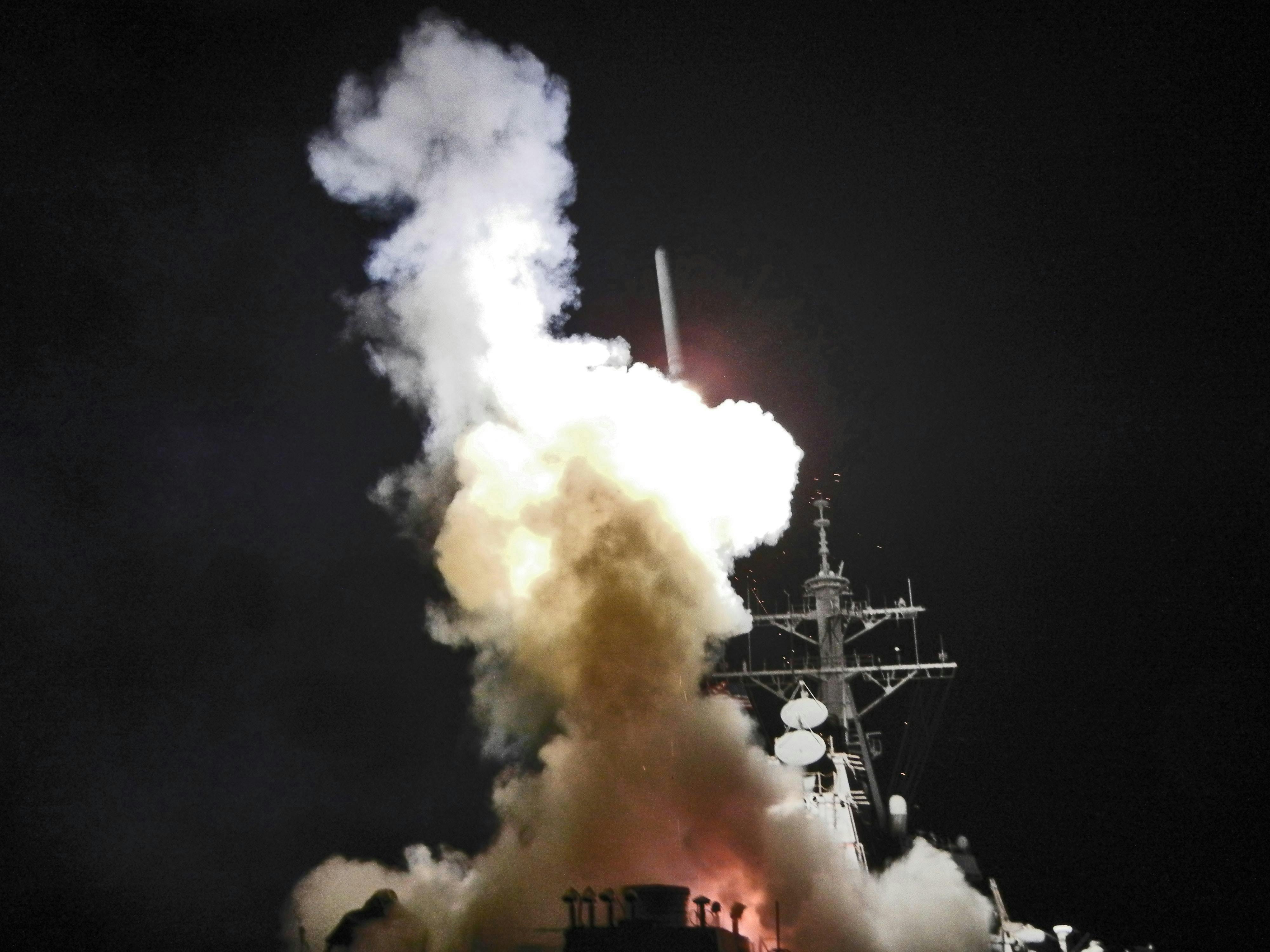 A Tomahawk missile launches from the Arleigh Burke-class guided-missile destroyer USS Barry