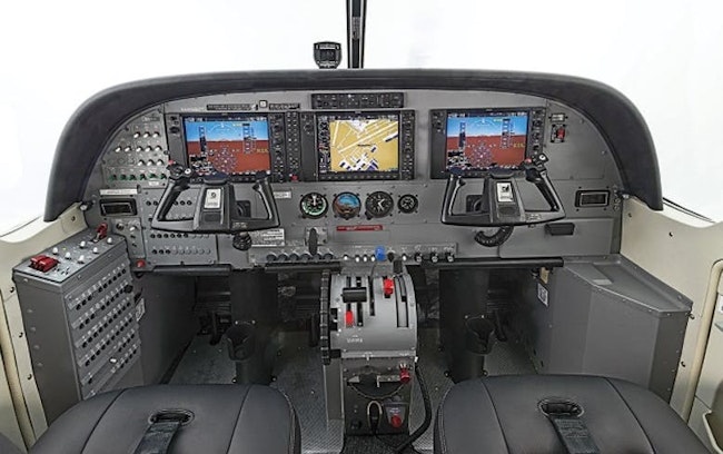 A photo of a small aircraft simulator with all the components of a cockpit