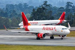 Two Avianca aircraft on the taxiway. Two Avianca aircraft on the taxiway.