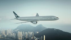 Cathay Pacific's 777 aircraft flies above a cityscape. Cathay Pacific's 777 aircraft flies above a cityscape.