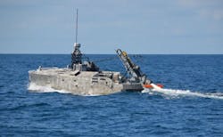 The AN/AQS-24B mine hunter being deployed from the Mine Countermeasures Unmanned Surface Vessel (MCM USV). The AN/AQS-24B mine hunter being deployed from the Mine Countermeasures Unmanned Surface Vessel (MCM USV).