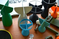 Prototype model of rocket bomb tip, colored models of tail fins, and tail cone printed on a 3D printer from molten plastic. Prototype model of rocket bomb tip, colored models of tail fins, and tail cone printed on a 3D printer from molten plastic.