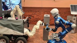 DLR's autonomous humanoid robot Rollin' Justin (right) and the ESA Interact Rover (left) being controlled from the International Space Station ISS. They are cooperating on the handling of a tool. Credit: DLR (CC BY-NC-ND 3.0). DLR's autonomous humanoid robot Rollin' Justin (right) and the ESA Interact Rover (left) being controlled from the International Space Station ISS. They are cooperating on the handling of a tool. Credit: DLR (CC BY-NC-ND 3.0).