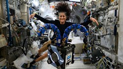 Astronaut Suni Williams floats behind the Astrobee robot onboard the International Space Station Astronaut Suni Williams floats behind the Astrobee robot onboard the International Space Station