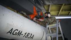 An Air Force ground crewman secures the AGM-183A Air-launched Rapid Response Weapon Instrumented Measurement Vehicle 1 (ARRW IMV-2) as it is loaded under the wing of a B-52H jet bomber at Edwards Air Force Base, Calif. An Air Force ground crewman secures the AGM-183A Air-launched Rapid Response Weapon Instrumented Measurement Vehicle 1 (ARRW IMV-2) as it is loaded under the wing of a B-52H jet bomber at Edwards Air Force Base, Calif.
