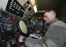 A U.S. Air Force battle management operator looks over a radar on the Nevada Test and Training Range during mobile decentralized command and control of joint operations. A U.S. Air Force battle management operator looks over a radar on the Nevada Test and Training Range during mobile decentralized command and control of joint operations.