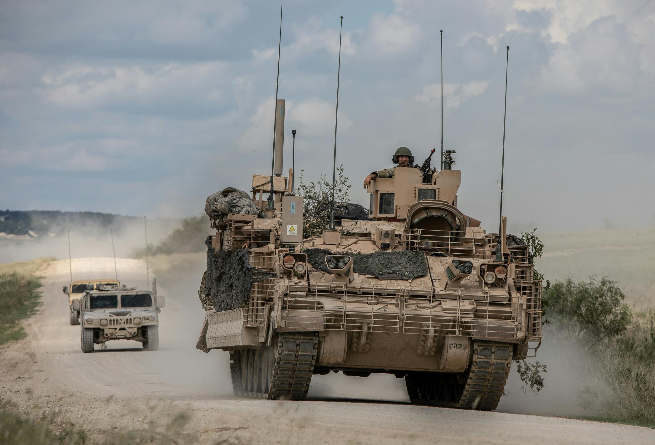 U.S. Army mechanized cavalry are escorted by observer controllers after completing field testing of the Armored Multi-Purpose Vehicle (AMPV).
