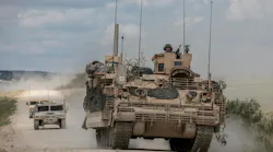 U.S. Army mechanized cavalry are escorted by observer controllers after completing field testing of the Armored Multi-Purpose Vehicle (AMPV).