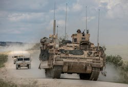 U.S. Army mechanized cavalry are escorted by observer controllers after completing field testing of the Armored Multi-Purpose Vehicle (AMPV). U.S. Army mechanized cavalry are escorted by observer controllers after completing field testing of the Armored Multi-Purpose Vehicle (AMPV).