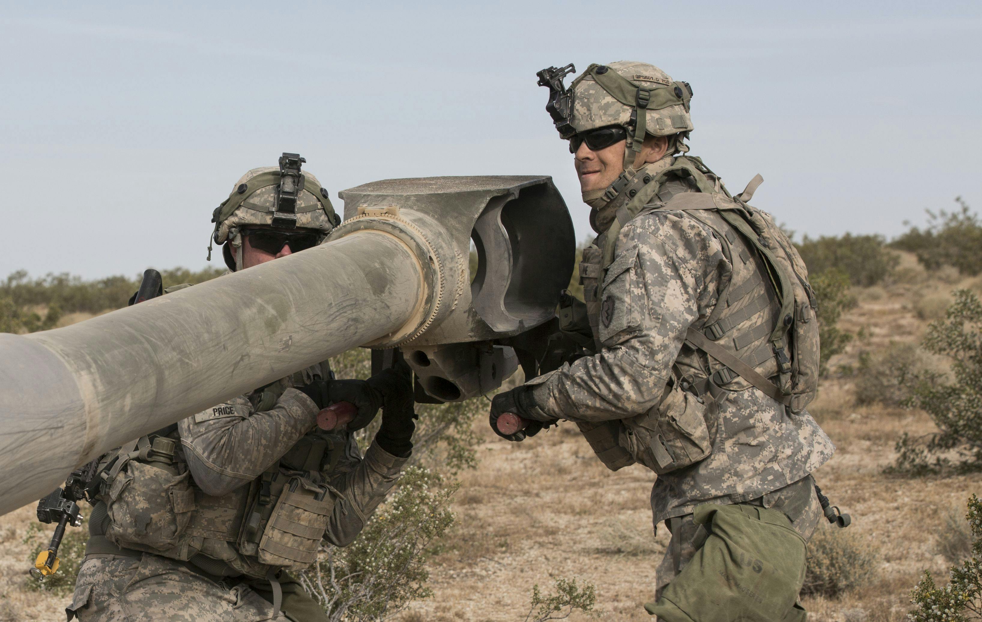 U.S. Army soldiers hook up a M777 howitzer during a targeting exercise at the National Training Center at Fort Irwin, Calif.