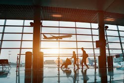 Family traveling with children, silhouette in airport. Family traveling with children, silhouette in airport.