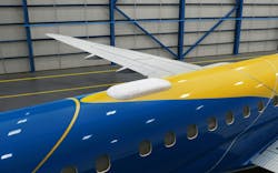 A photo of the Intelsat receiver on top of an Embraer plane A photo of the Intelsat receiver on top of an Embraer plane