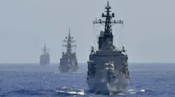 U.S. and allied surface warships sail in formation to conduct an air-defense exercise aimed at interoperability during realistic shared training.