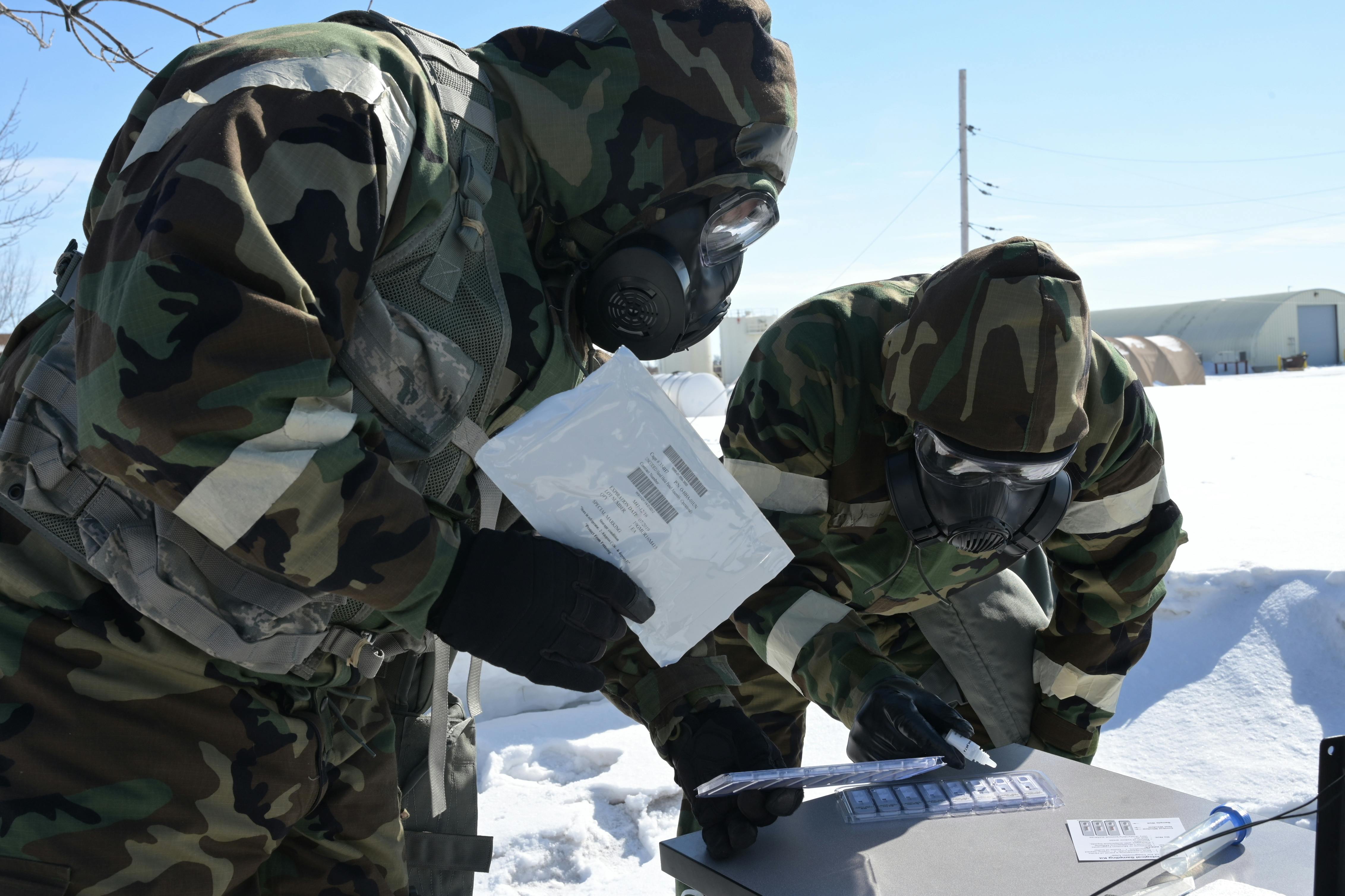 Air Force emergency management members use chemical, biological, radiological and nuclear (CBRN) detection equipment during a training exercise in Fargo, N.D.