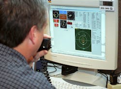 An unmanned vehicle ground controller examines the screen of his ground control station during tests in New Mexico. An unmanned vehicle ground controller examines the screen of his ground control station during tests in New Mexico.