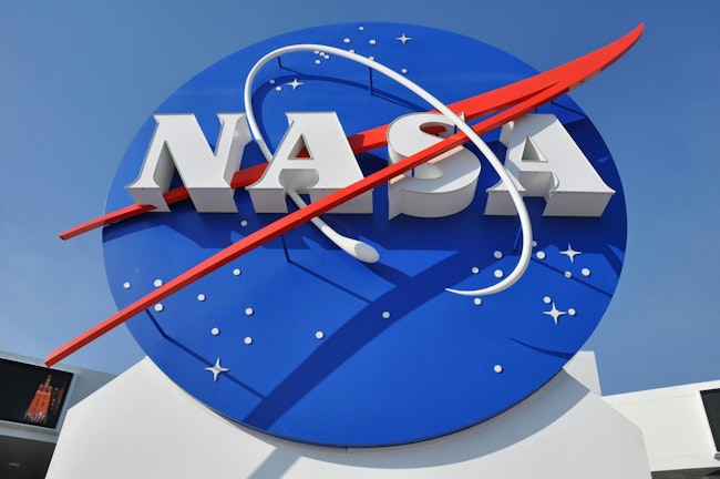 A sign outside a NASA facility with the agency's logo