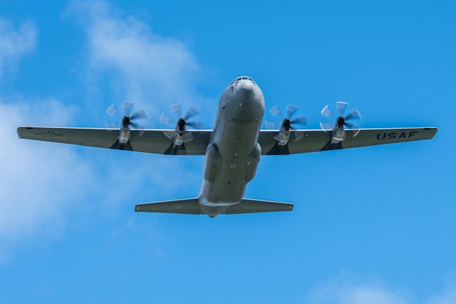 A C-130J Super Hercules performs a flyover during the 125th celebration of Flag Day at Pago Pago, American Samoa
