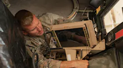 An Army signal support systems specialist installs a Joint Battle Command–Platform (JBC-P) during a communications exercise in Kuwait.
