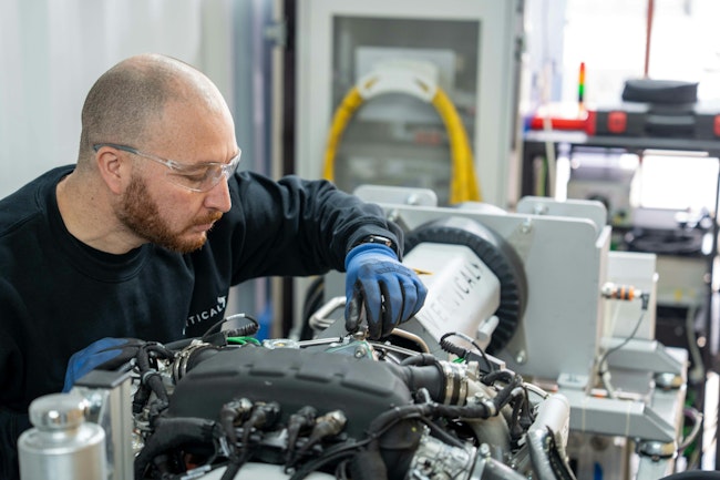 A technician works on a Vertical Aerospace propulsion system