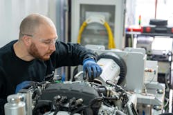 A technician works on a Vertical Aerospace propulsion system A technician works on a Vertical Aerospace propulsion system