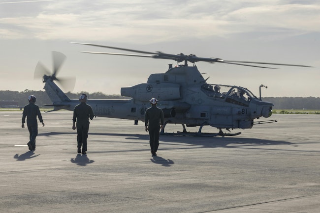 U.S. Marine Corps aviation ordnance technicians approach an AH-1Z Viper attack helicopter to clear it of any live ordnance at Marine Corps Air Station Cherry Point, N.C., earlier this month.