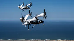 A pair of Joby eVTOL aircraft flying in tandem