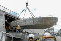 A Mine Countermeasures Unmanned Surface Vessel (MCM-USV) is craned aboard the littoral combat ship USS Canberra (LCS 30) last month. The vessel's counter-mine sensor and weapons payloads help locate, identify, and destroy ocean mines. A Mine Countermeasures Unmanned Surface Vessel (MCM-USV) is craned aboard the littoral combat ship USS Canberra (LCS 30) last month. The vessel's counter-mine sensor and weapons payloads help locate, identify, and destroy ocean mines.