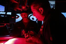 The captain of the destroyer USS Bulkeley (DDG 84) reviews log books during a deployment to support the warfighting effectiveness. The captain of the destroyer USS Bulkeley (DDG 84) reviews log books during a deployment to support the warfighting effectiveness.