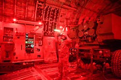 A U.S. Air Force loadmaster places a HIMARS launcher and artillery crews aboard a C-17 Globemaster III cargo jet using night-vision goggles during an exercise last March. A U.S. Air Force loadmaster places a HIMARS launcher and artillery crews aboard a C-17 Globemaster III cargo jet using night-vision goggles during an exercise last March.