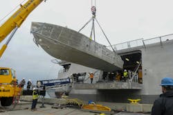 An unmanned surface vehicle is craned aboard the Independence-variant littoral combat ship USS Canberra (LCS 30) during the first embarkation of the mine countermeasures (MCM) mission package. The MCM mission package is an integrated suite of unmanned maritime systems and sensors which locates, identifies, and destroys mines in the littorals while increasing the ship’s standoff distance from the threat area. U.S. Navy photo An unmanned surface vehicle is craned aboard the Independence-variant littoral combat ship USS Canberra (LCS 30) during the first embarkation of the mine countermeasures (MCM) mission package. The MCM mission package is an integrated suite of unmanned maritime systems and sensors which locates, identifies, and destroys mines in the littorals while increasing the ship’s standoff distance from the threat area. U.S. Navy photo