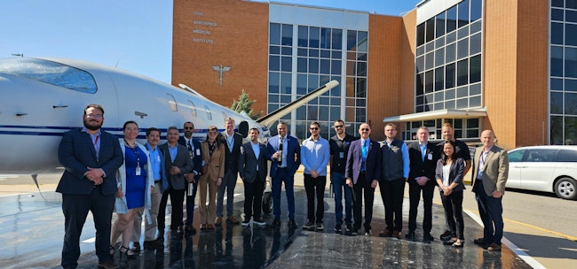 A group photo in front of the FAA CAMI