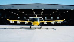 A photo of a Wisk Aero aircraft outside a hangar A photo of a Wisk Aero aircraft outside a hangar