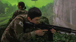 An Army soldier interacts with a Korean weapons simulation in South Korea last fall.
